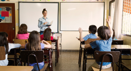 Teacher in front of classroom 